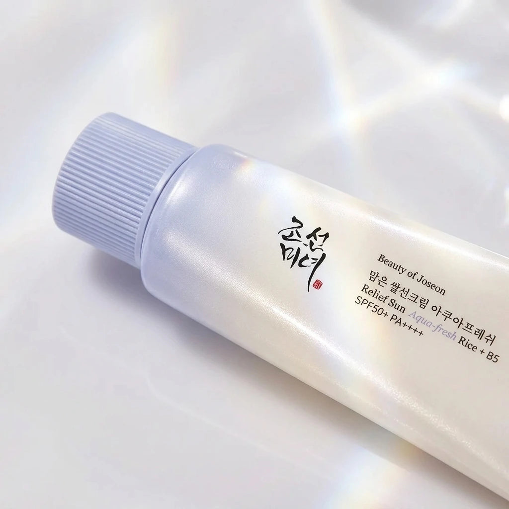 Angle : macro produit  Beauty of Joseon Relief Sun SPF50+ surrounded by luminous reflections and soft pearlescent highlights, glass skin inspired skincare campaign, luxury Korean beauty advertising, photorealistic product photography, ultra detailed. (gemini-3.1-flash-image-preview)