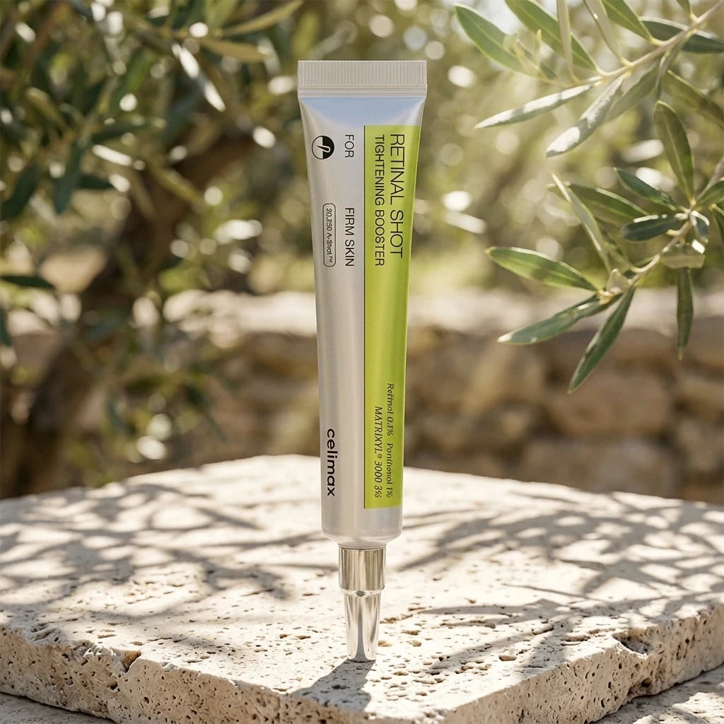 Outdoor commercial product photography of "Celimax The -A Retinol Shot Tightening Booster" 15ml bottle. The product is standing on a raw, textured travertine stone block. Bright morning sunlight filtering through olive tree leaves, casting elegant, dappled organic shadows. Natural, fresh, ultra-crisp details. Shot on 70mm lens, F7, ISO 250, photorealistic, realistic textures, no CGI --ar 1:1 (gemini-3.1-flash-image-preview)