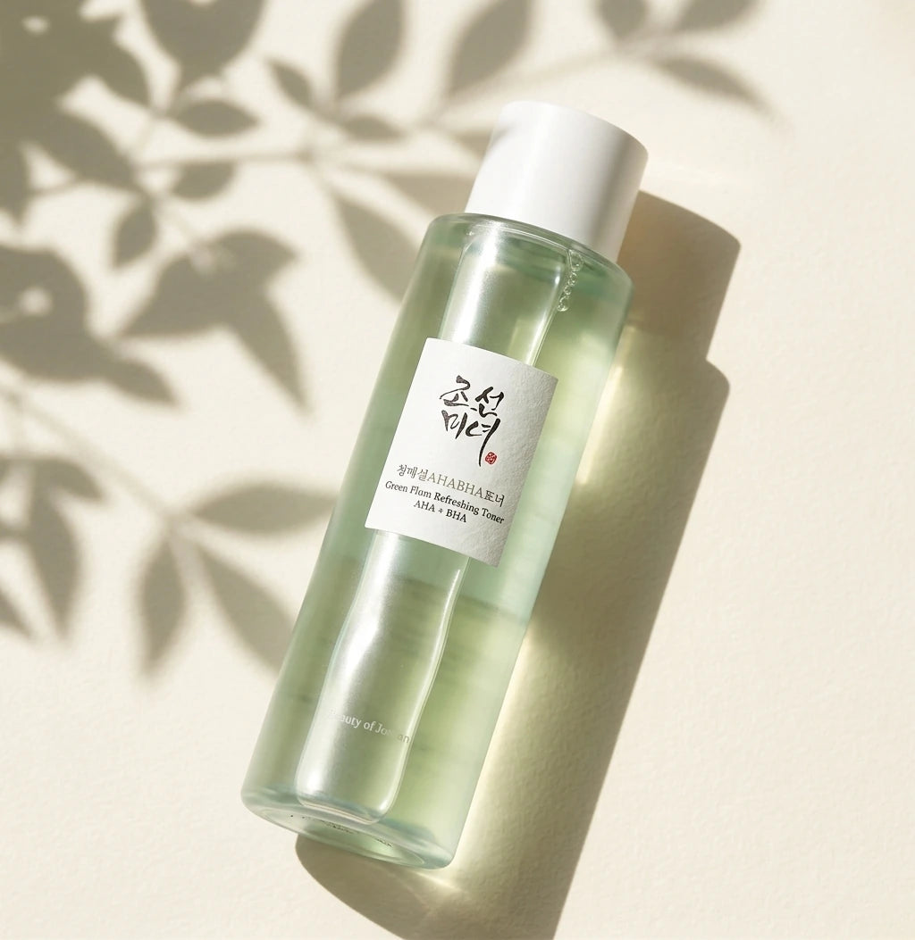Angle face  Beauty of Joseon Green Plum Refreshing Toner on soft ivory background with delicate leaf shadows projected by sunlight, minimalist Korean skincare aesthetic, realistic shadows, premium beauty campaign, luxury commercial photography. (gemini-3-pro-image-preview)