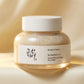 Angle : face légèrement rapprochée  Beauty of Joseon Ground Rice and Honey Glow Mask on creamy ivory surface with soft golden reflections and luminous glow effect, skincare radiance concept, luxury Korean beauty campaign, photorealistic product photography, premium advertising style. (gemini-3-pro-image-preview)