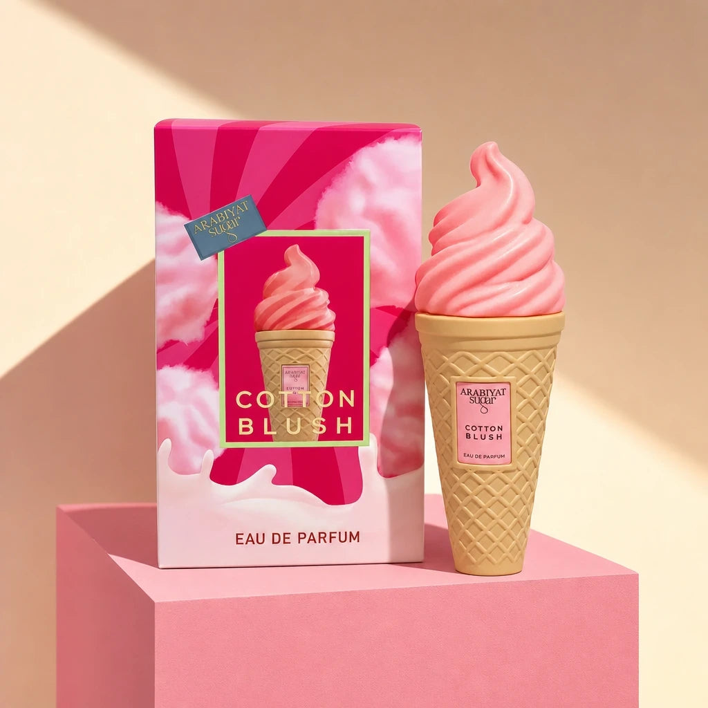 Bold, contemporary e-commerce product shot of the Arabiyat Sugar Cotton Blush perfume bottle and box (image_b1ef0b.jpg). The products are displayed on a matte pastel pink geometric pedestal against a clean, contrasting light beige backdrop. High-contrast, sharp architectural shadows cut elegantly across the frame, simulating a modern candy shop or trendy boutique lighting. Fresh, youthful, and eye-catching layout. Aspect ratio 1:1, size 1200x1200px. (gpt-image-2)